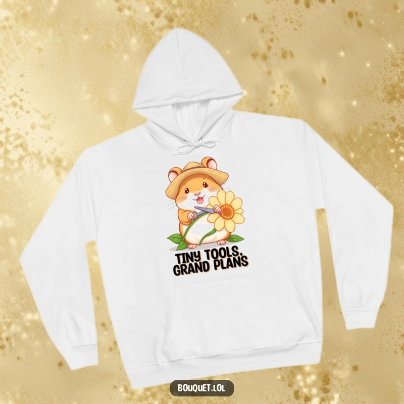 Funny hoodie depicting a cheerful hamster in a straw hat, using tiny scissors to snip a flower stem, conveying a sense of gardening accomplishment.